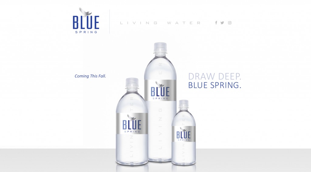 The temporary landing page for Blue Spring Water's website, featuring three water bottles and the words, 