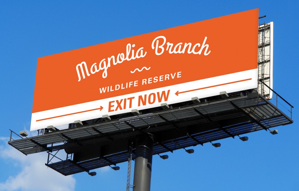 An exit billboard for Magnolia Branch Wildlife Reserve.